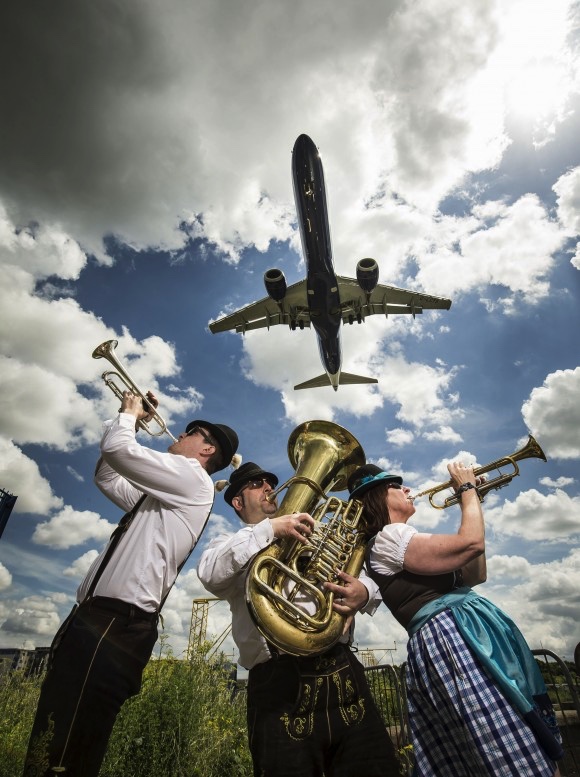 Serenading the start of new British Airways flights from London City to Berlin are Oompah band members (left-right) Geoff Moore, Matt Hadden and Elaine Williams. Picture from British Airways.