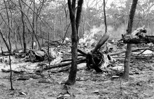 This is a general view of men searching the site of the plane wreckage near Ndola, Zambia on Sept. 19, 1961. Passenger U.N. Secretary General Dag Hammarskjold was en route to a meeting with Katanga's President Moise Tshombe to negotiate the Congo crisis at Ndola when his plane crashed in a forest near the city on Sept. 18. (AP Photo)