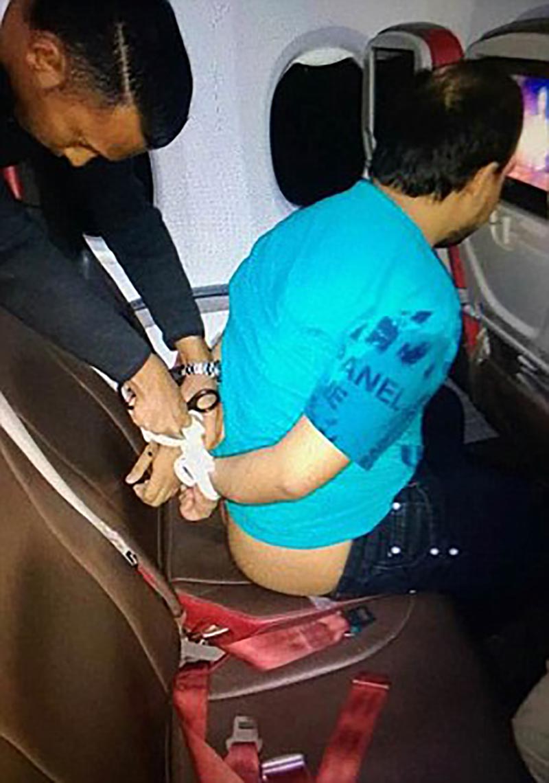 The passenger allegedly attacked a flight attendant and walked around naked...